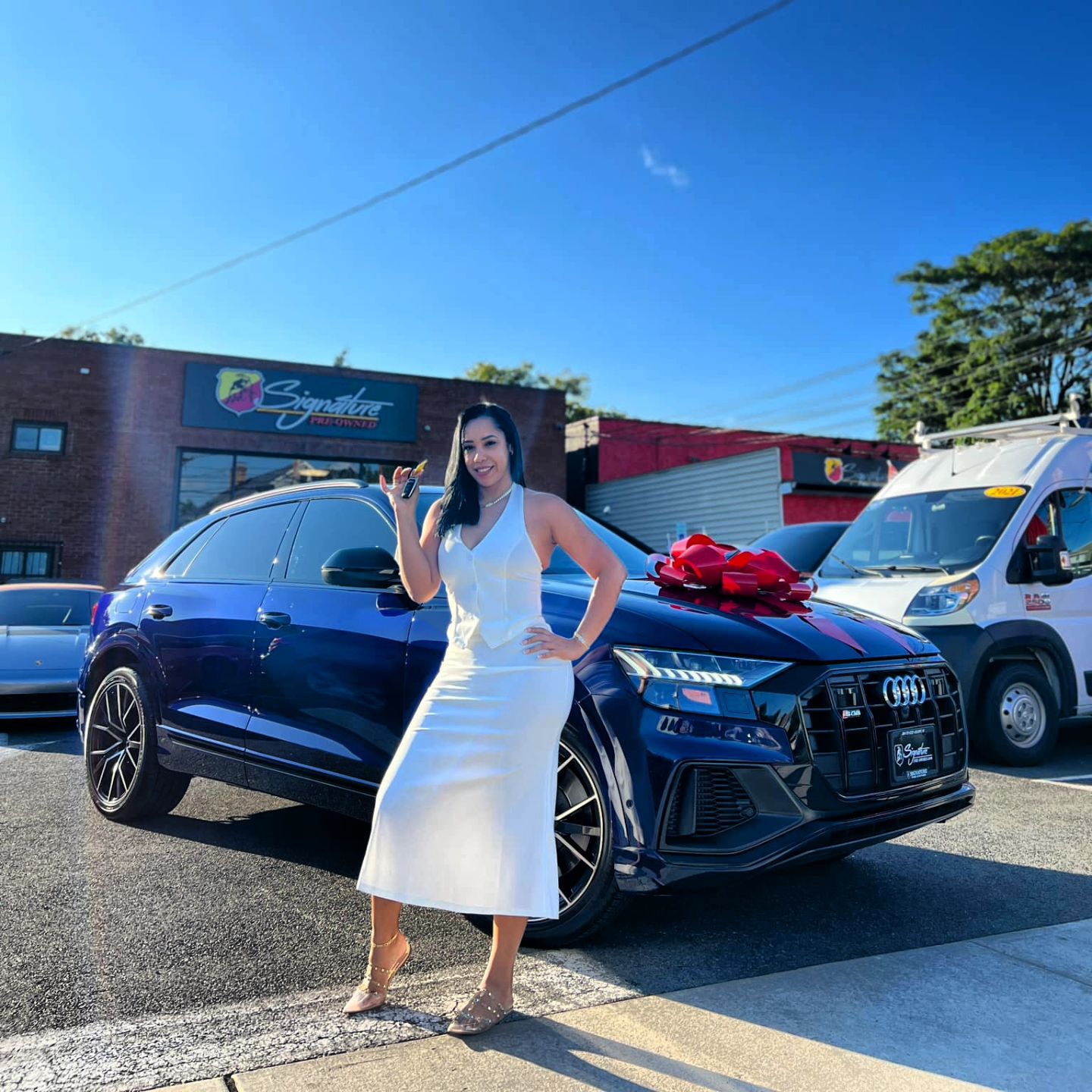 Signature Pre-Owned Facebook ad: @jatnnajbl is all smiles with her new Prestige!