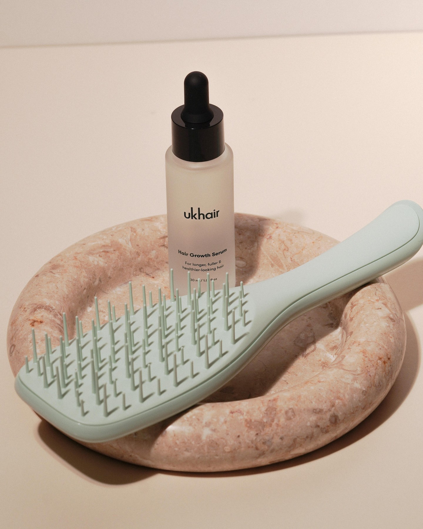 Uklash Facebook ad: INTRODUCING UKLASH X TANGLE TEEZER