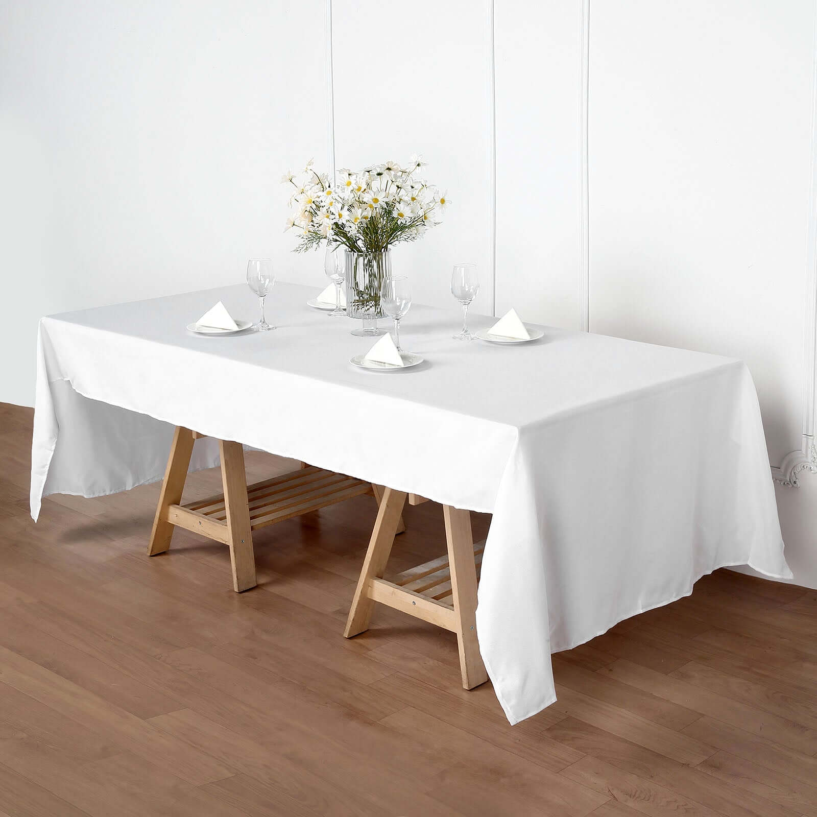 eFavormart Facebook ad: All-white table linens keep late summer weddings bright…