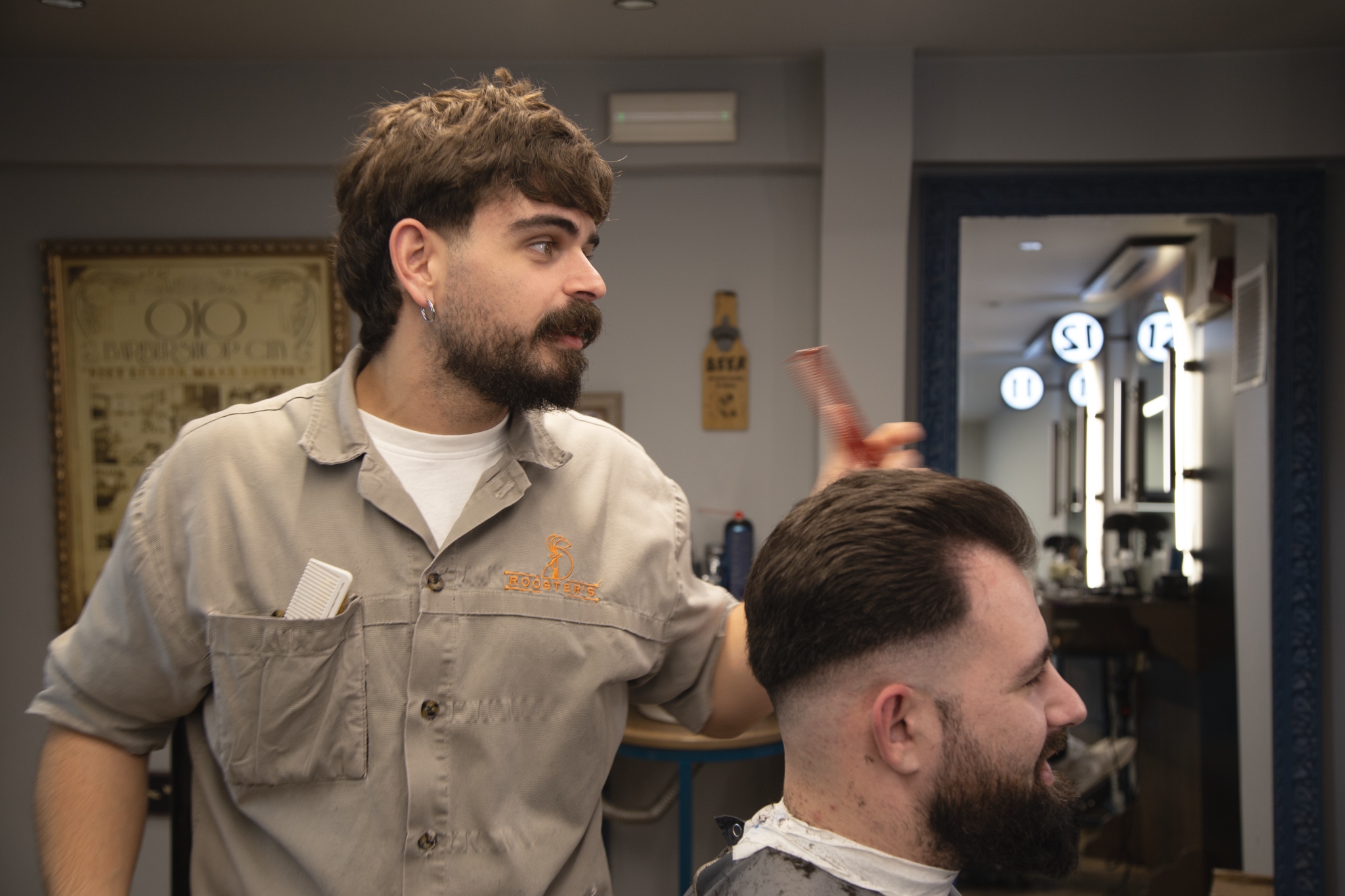 Roosters Barbershop Facebook ad from Feb 21, 2026