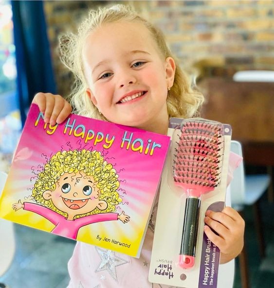 Happy Hair Brush Facebook ad: Detangles Hair Easy100%