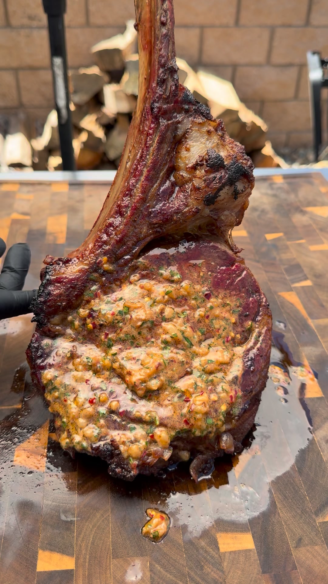 Hasty Bake Charcoal Grills Facebook ad: Smoked tomahawk steak from @cooking_with_fire___ on the…
