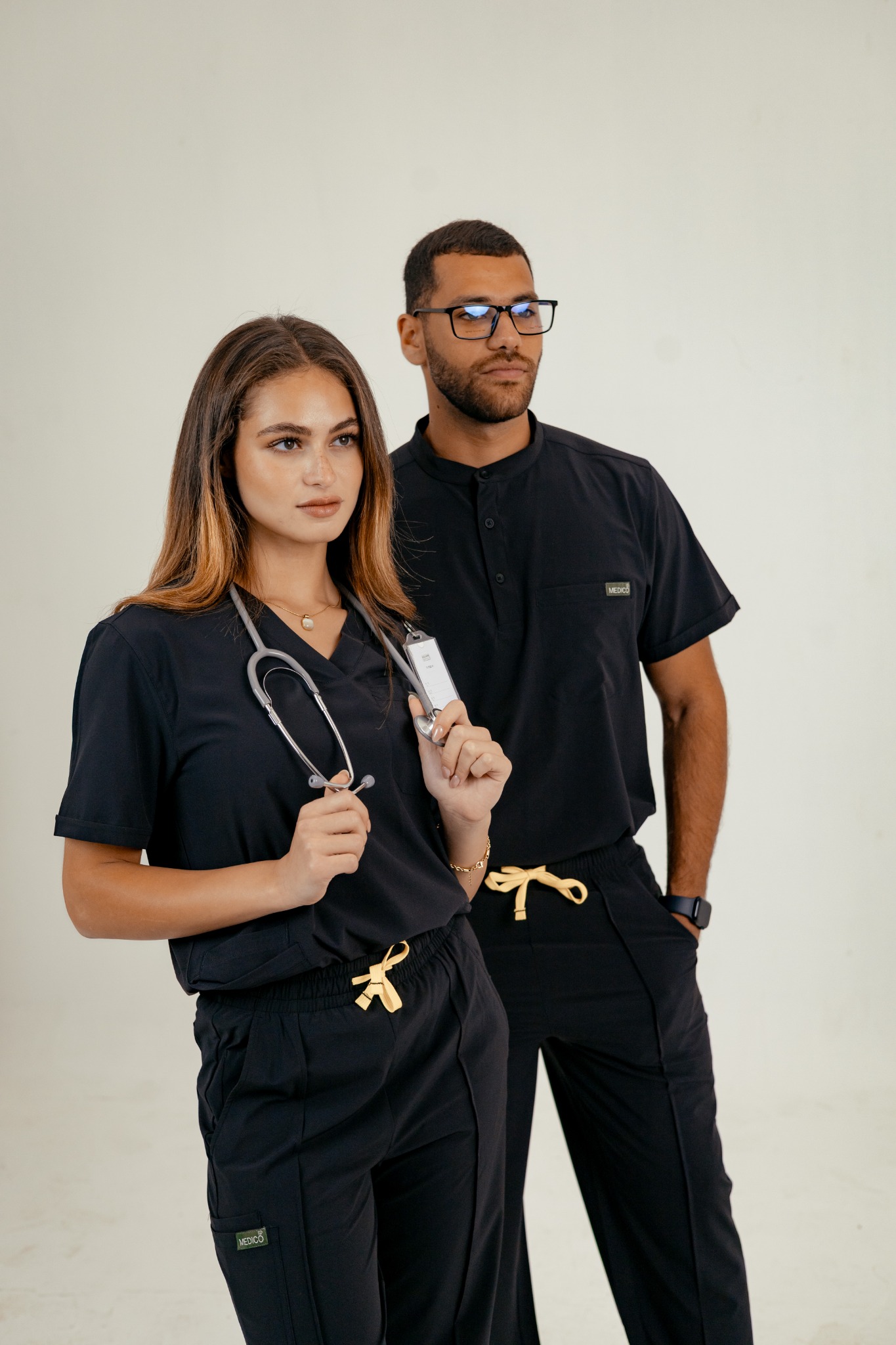 Medico.wear Facebook ad: For those who mean business, Medico black scrubs.