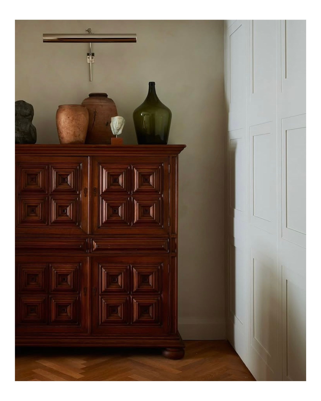 AMARU ANTIQUES Facebook ad: A long, rustic surface stretches across the wall…