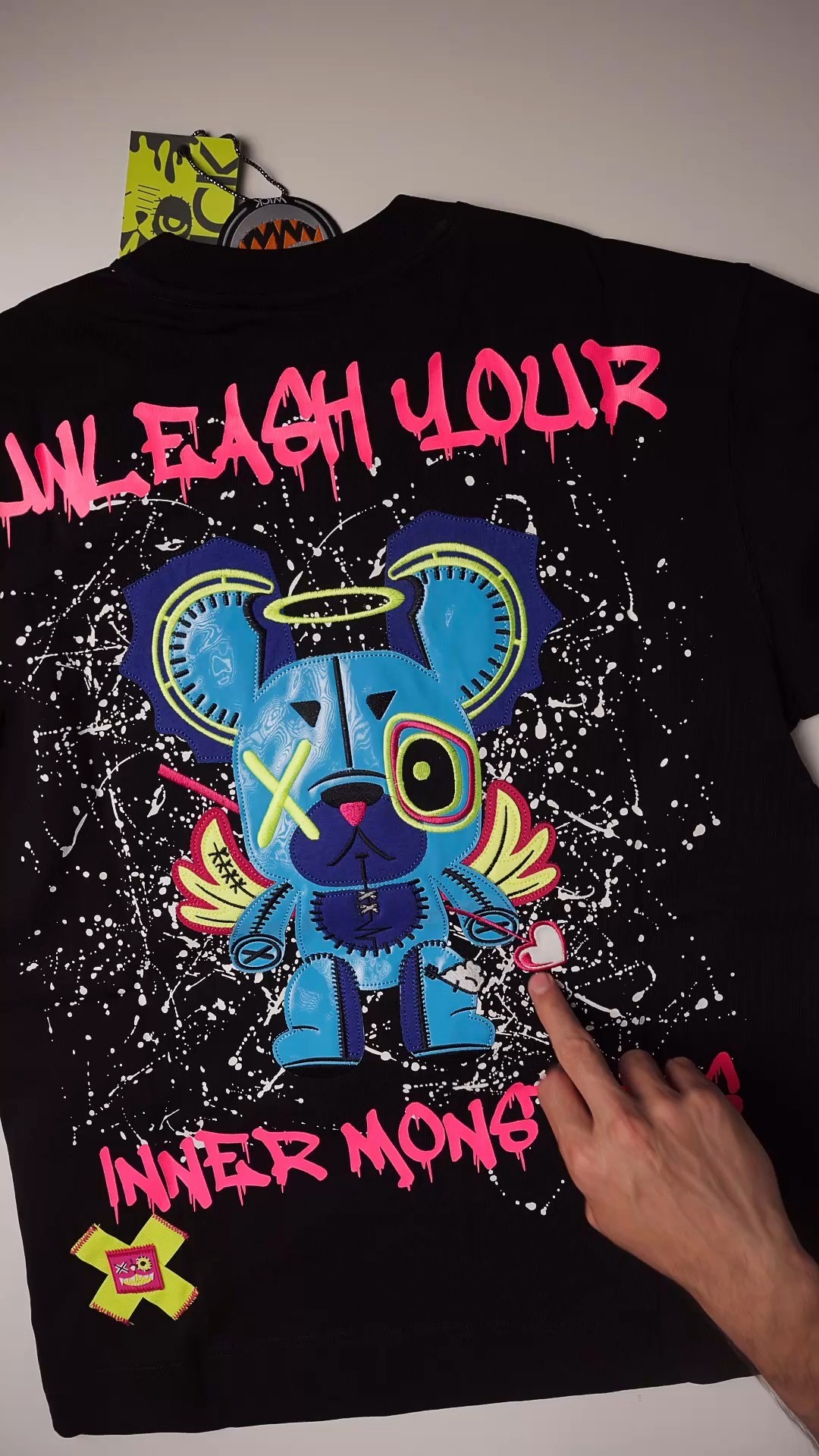 Wickmonsters Facebook ad: Introducing our Oversized NR Arrow Black Tee, Neon…