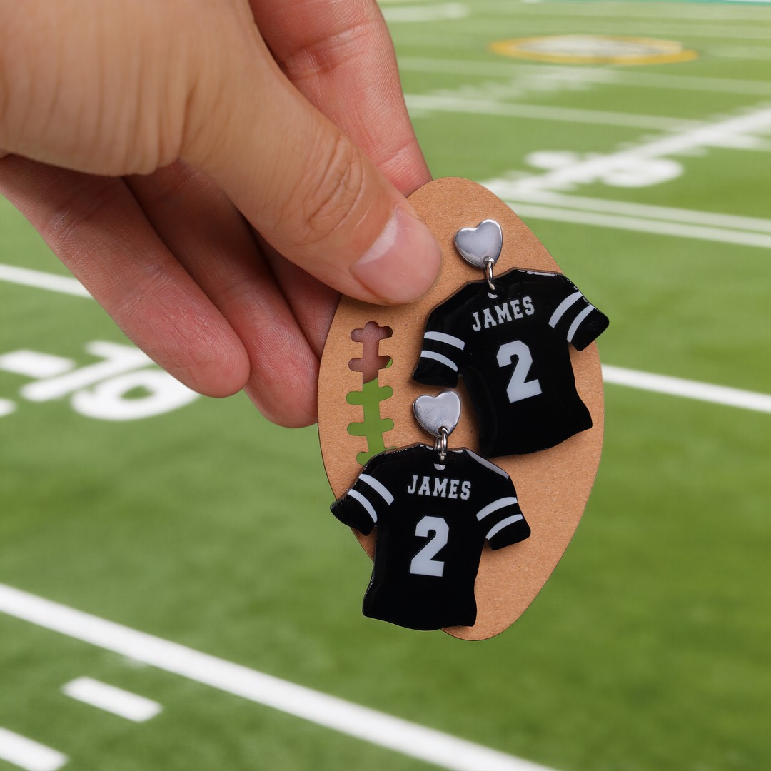 Callie Gifts Facebook ad: Personalized Glittery Football Jersey Design Earrings…