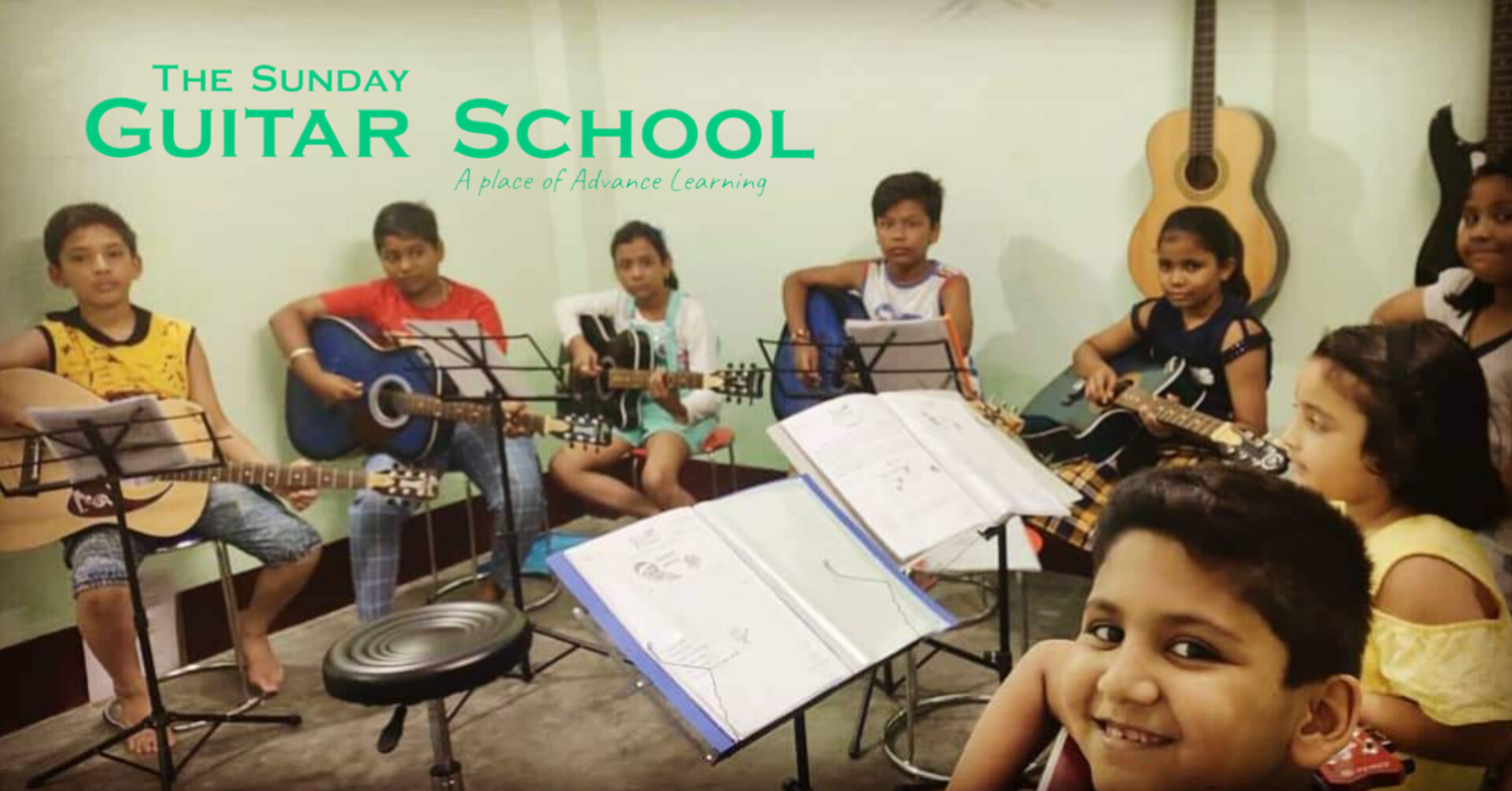 The Sunday Guitar School Facebook ad: ONLINE & OFFLINE CLASSES WITH ADVANCED GUITAR LESSONS…