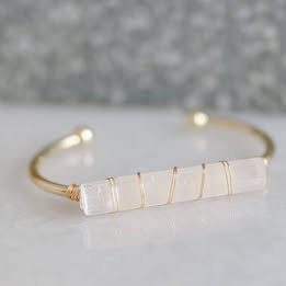 Jeannette August Facebook ad: Natural 6- 6 1/2 Crystal Gold Bangle Stone Bracelet…